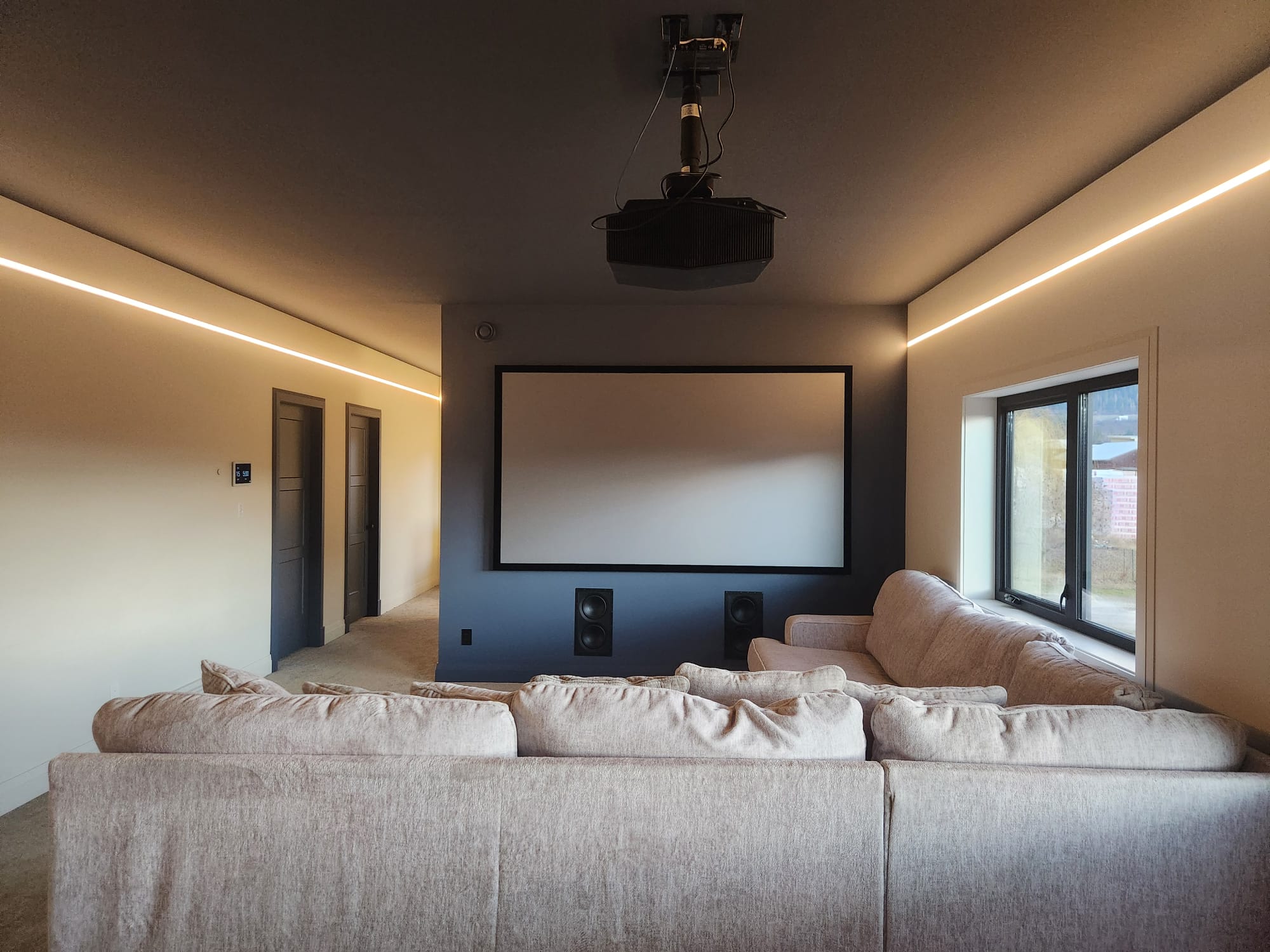 Professional home theater installation with smart lighting by Big Tree Electrical